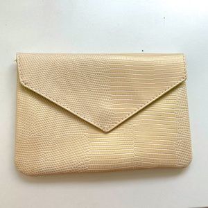 IPSY gold cosmetic bag/clutch with snap closure
